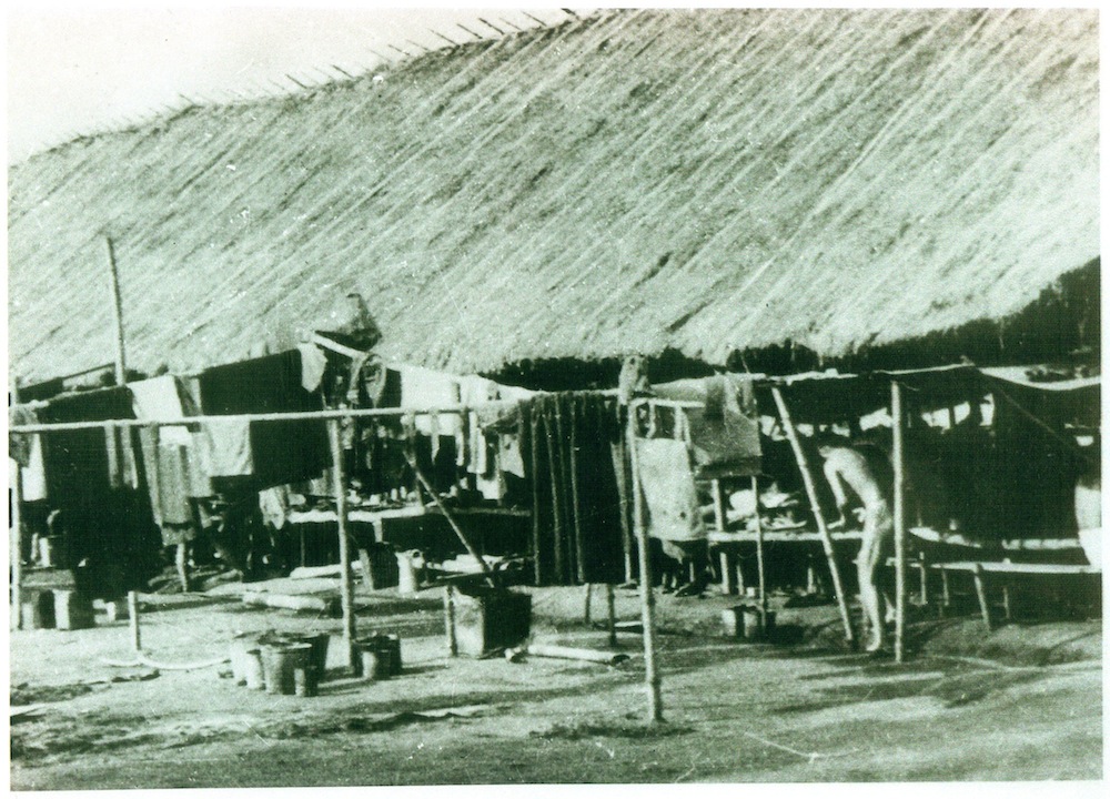 One of the huts that Peter lived. Loin Huts built by POW and wearing loin clothe.jpg
